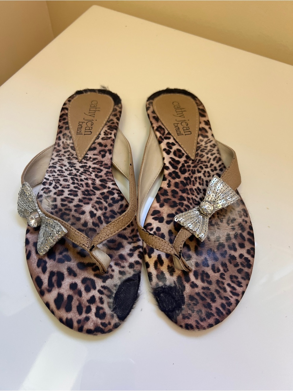 Cathy Jean Leopard Print Rhinestone Bow Thong Sandals in Tan and Brown